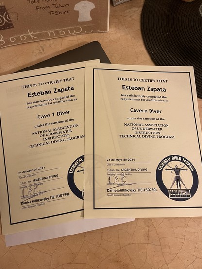 Photo of two certificates, one for cavern and the other for cave 1, both from NAUI technical division.