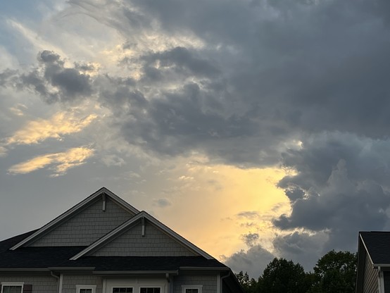 There's this ethereal orange glow shining from behind the clouds....