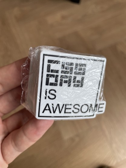 A pile of stickers, showing the “CSS is awesome” box overflowing meme thingy, but with the CSS Day logo, so it says “CSS Day is awesome”. It’s funny. For like 5 people.