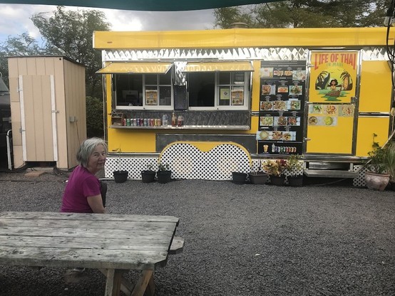 Woman awaiting a meal from Life of Thai food truck on Maui.