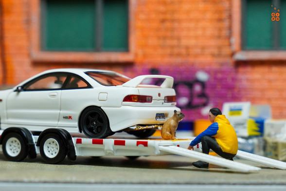 A rear side of Honda Integra Type R (DC2) Spoon Sports by Nice Auto with a dog and a man in 1:64 scale with 1:64 figure on AREA 164