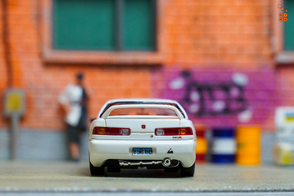 A rear side of Honda Integra Type R (DC2) Spoon Sports by Nice Auto in 1:64 scale with 1:64 figure on AREA 164