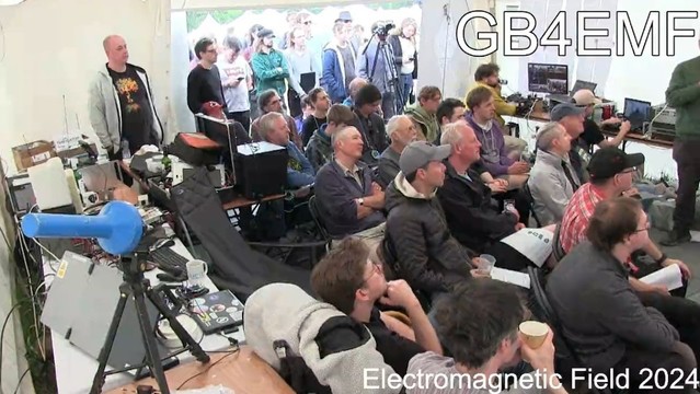 Screen grab of the uplinked video stream of the talks audience with the radio callsign GB4EMF visible