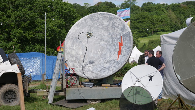 Big uplink dish and smaller downlink dish pointing at QO-100