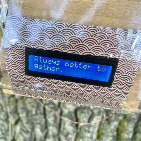 A close-up of the screen after pressing the button. On it is now written “always better together”