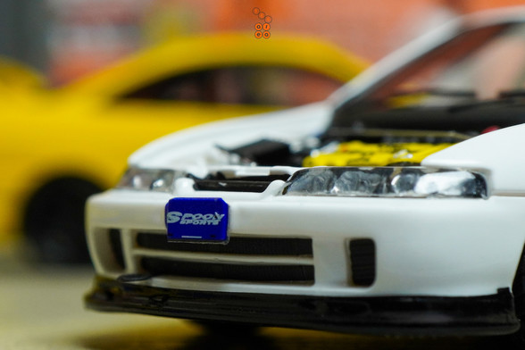 A close-up of Honda Integra Type R (DC2) Spoon Sports by Nice Auto in 1:64 scale with 1:64 figure on AREA 164