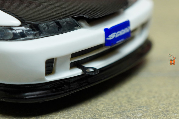 A close-up of Honda Integra Type R (DC2) Spoon Sports by Nice Auto in 1:64 scale with 1:64 figure on AREA 164