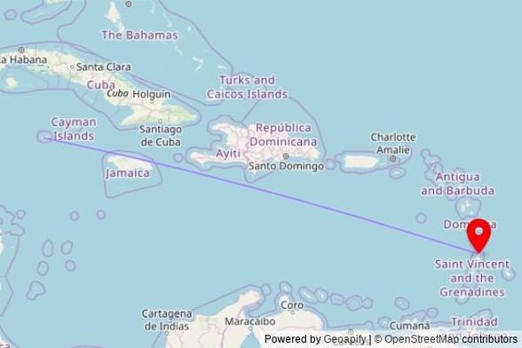 A map showing the great circle route from George Town in the Cayman Islands to a map pin at God's Trumpet to the Nations, Reduit Road, Rodney Bay, Saint Lucia
