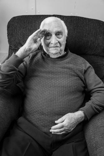 Portrait of Canadian World War II veteran saluting.