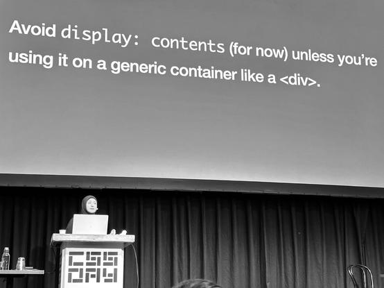 Sara on stage. Slide content:

Avoid display: contents (for now) unless you're using it on a generic container like a <div>.