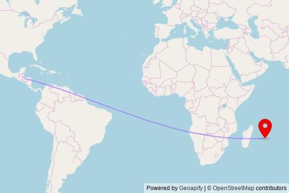 A map showing the great circle route from Potrerillos in Honduras to a map pin at Salle du Royaume des Témoins de Jéhovah de Forest Side, Desjardins Street, Vacoas-Phoenix, Mauritius