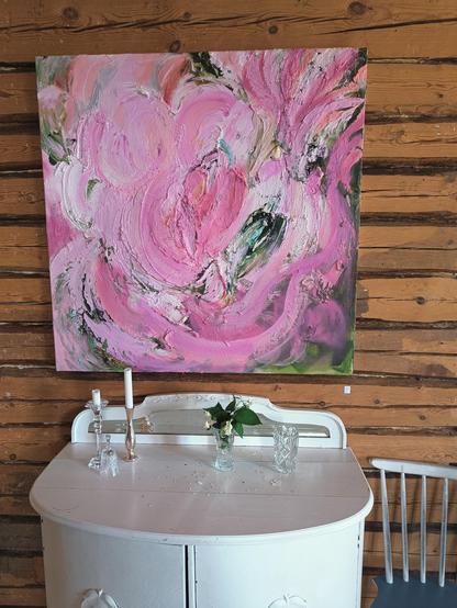 A pink painting on the wall 