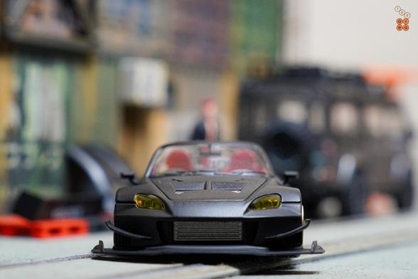A front side of Honda S2000 Race Car, Voltex Time Attack by Micro Turbo in 1:64 scale with 1:64 figure on AREA 164