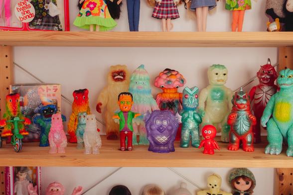 Image of the shelves in my studio, where you can see part of my sofubi toy collection. All the toys look very bright and colorful, almost like candy.
