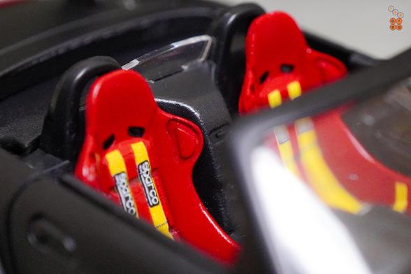 A close-up shot of Honda S2000 Race Car, Voltex Time Attack by Micro Turbo in 1:64 scale with 1:64 figure on AREA 164