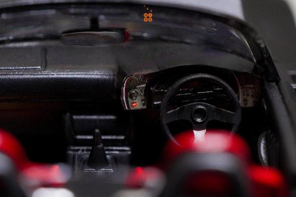A close-up shot of Honda S2000 Race Car, Voltex Time Attack by Micro Turbo in 1:64 scale with 1:64 figure on AREA 164