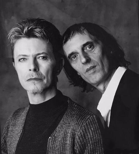 A picture of David Bowie with Dario Argento leaning over is shoulder