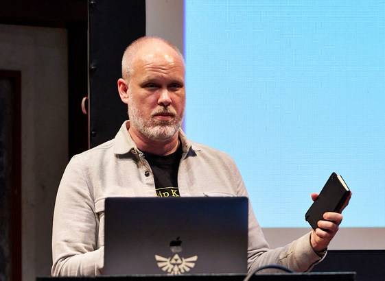 Speaker behind a lectern on stage