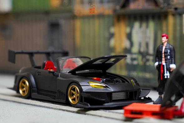 A man stand beside Honda S2000 Race Car, Voltex Time Attack by Micro Turbo in 1:64 scale with 1:64 figure on AREA 164