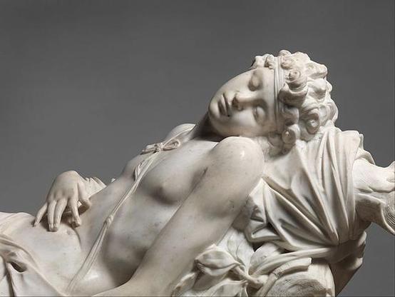 Marble sculpure of Adonis lying dead or dying. His face is serene and no injuries can be seen, so that the onlooker might think he is just asleep.