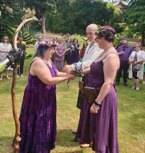 Me and my wife being bound together by our close friend and local druidic priestess Suzie, for "a year and a day or as long as love lasts"

Yes that is a Starfleet uniform in the crowd (there was more than one 😁)