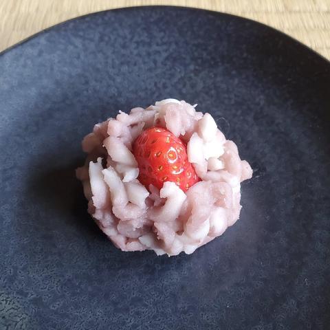 A winter kinton, topped with a strawberry.