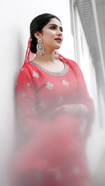 Swaswika dazzles in her latest traditional red Eid outfit, combining elegance with a touch of modern flair. Her striking dress, adorned with intricate details, is a testament to her impeccable fashion sense. Swaswika's look is not just a celebration of Eid but also a nod to the beauty of traditional attire. Get inspired by her stunning style and celebrate Eid in fashion.