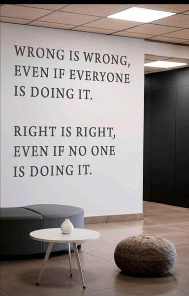 Photo of a wall mural, most likely not in an office owned by Musk, with a humanistic message that reads: Wrong is wrong, even if everyone is doing it. Right is right, even if no one is doing it.
