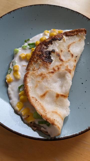 Homemade ขนมครก / Thai coconut pancake with corn and spring onions.