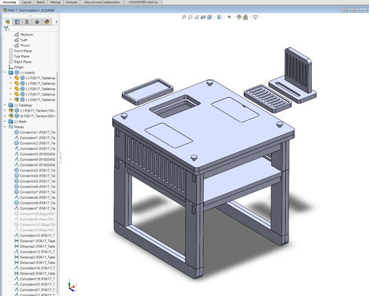 Screenshot of a small table in CAD with many small parts, some parts floating in the air