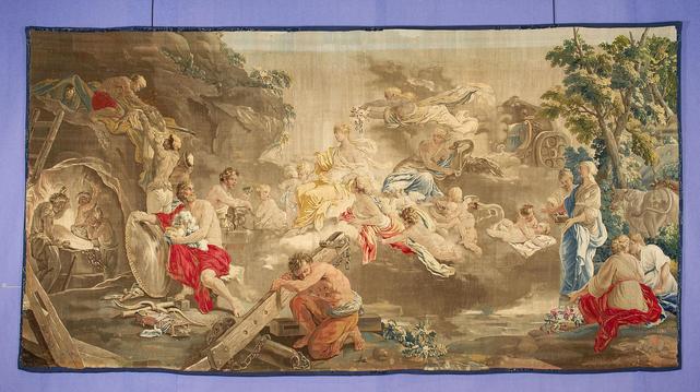 a tapestry, there are many figures from roman mythology in a rocky landscape with twisting trees, on the left in a cave is a blacksmith pounding an anvil, really ornate and decorative and lovely looking 