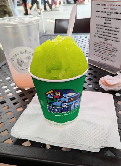 Image shows a small cup of lime shaved ice from Kona Ice