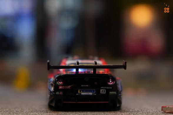 A rear side of Nissan GT-R Nismo GT500 No.23 “MOTUL AUTECH GT-R" NISMO ​2021 SUPER GT SERIES by MINI GT in 1:64 scale on AREA 164