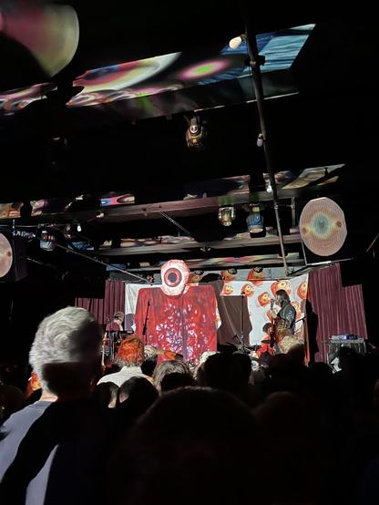 Band, “Of Montreal,” on stage at Sister Bar in Albuquerque, NM. Eyeballs are projected all over the stage as the band enters.