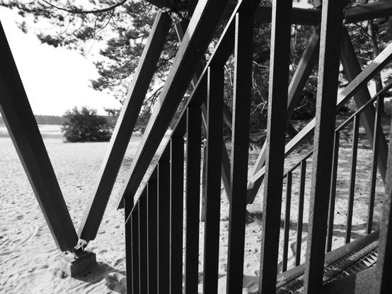 A closer look at the stairs, with more sand in the distance 