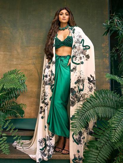 Shilpa Shetty's emerald green Indo-Western dress is a fashion masterpiece that showcases her elegant and sophisticated style. This dress beautifully blends traditional Indian elements with a modern twist, making it a standout look. Shilpa's emerald green dress is a must-see for anyone seeking fashion inspiration. Dive into the details of her stunning ensemble and get ready to elevate your own style. See the photos now!