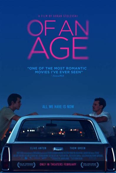 Poster of the Film "Of An Age".
It shows the 2 main male characters standing facing each other, across a parked car seen from behind.
Background is twilight sky with the movie title in large pink letters, fading at the edges.