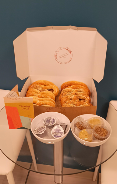 photo of a "thank you" card and pretzels on a glass table