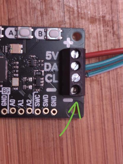 A Pimoroni 2040 Plasma board, with a screw terminal block for LED wires. That block is missing an internal screw.