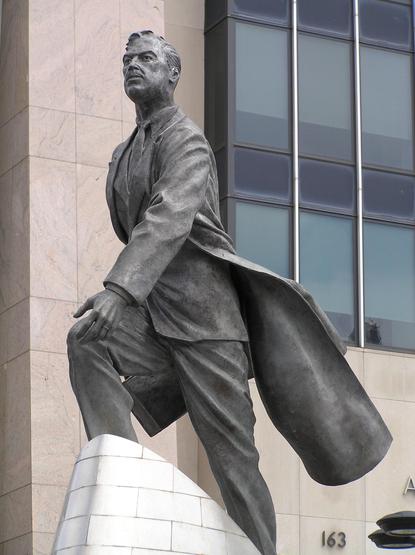 statue of Adam Clayton Powell Jr. striding up a hill.  His coat is billowing behind him.  Very inspiring.  Statue is in front of the Adam Clayton Powell Jr. federal building in New York City.  