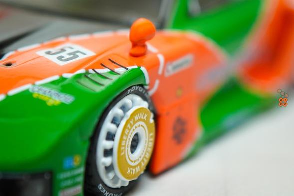 A close-up shot of Mazda RX-7 FD3S, LB-Super Silhouette Renown livery by iNNO64 in 1:64 scale with 1:64 figure on AREA 164