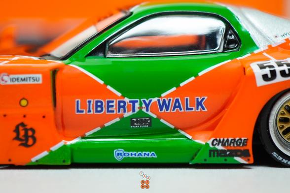 A close-up shot of Mazda RX-7 FD3S, LB-Super Silhouette Renown livery by iNNO64 in 1:64 scale with 1:64 figure on AREA 164