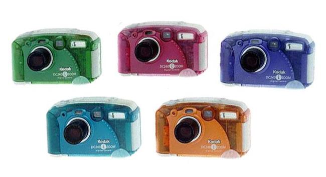 stock picture of Kodak DC240. A chunky 1998 camera with a variety of translucent coloured camera bodies in green, ruby, blue,teal and orange
