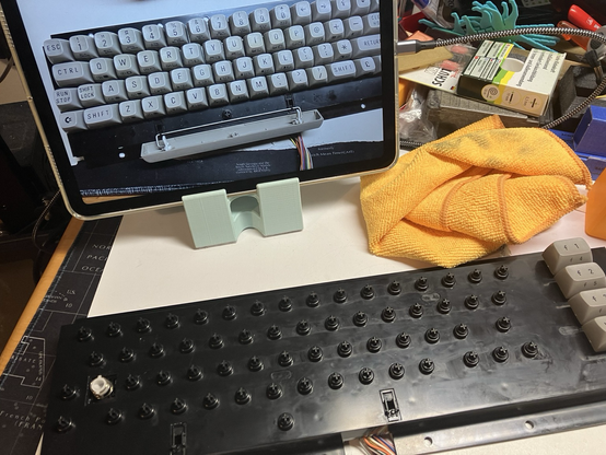 A Commodore 16 keyboard without keys after bleaching the keys and cleaning everything, the ipad shows where the keys have to go again.
