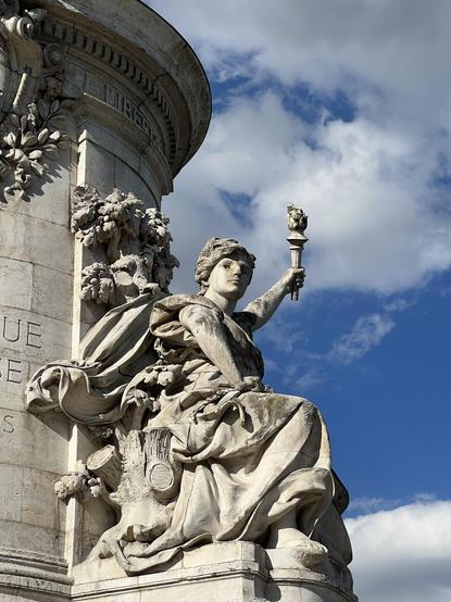 The statue of Liberté, as part of the larger monument at Place de la République in Paris.