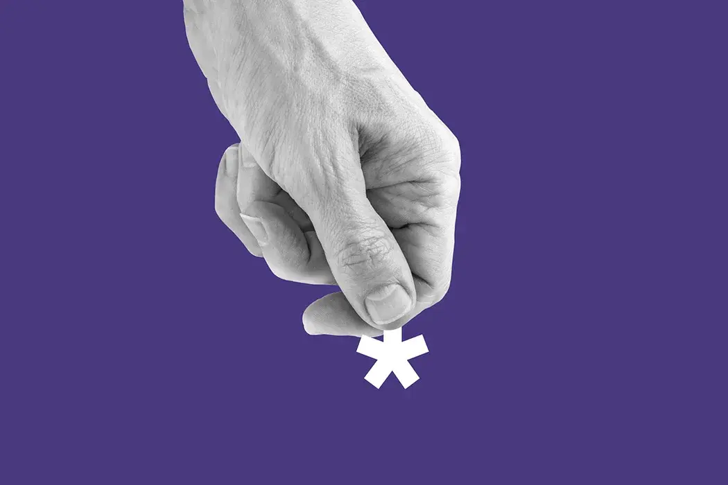 A hand grasping a white cross against a purple backdrop.