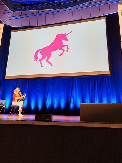 Pink unicorn in a slide to represent the magic of AI