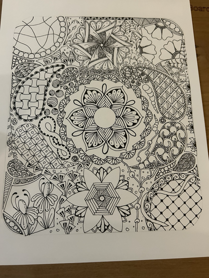 Tangled design on card, mandala in the middle with circles, hexagons and teardrops around with intricate tangled patterns inside