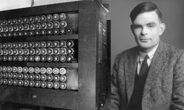 Photo of Alan Touring with Christopher, the machine he helped to create to break Germany's Enigma encryption.