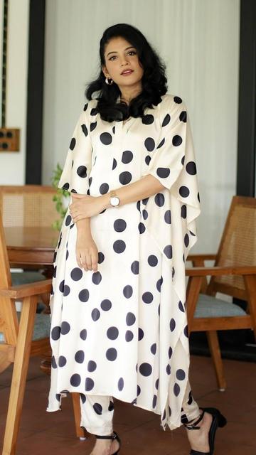 Discover the charm of casual chic with Shivada's stunning polka dot outfit! This black and white ensemble is the epitome of effortless style, combining timeless polka dots with modern flair. Perfect for any casual occasion, Shivada's look is both playful and sophisticated, making it a versatile addition to your wardrobe. Whether you're meeting friends or enjoying a day out, this outfit will ensure you look stylish and feel comfortable. Get inspired by Shivada and embrace the polka dot trend for a fashionable casual look!